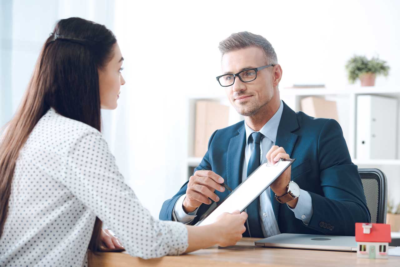 insurance-agent-pointing-at-clipboard-in-clients-h-2024-11-18-04-39-26-utc2.jpg
